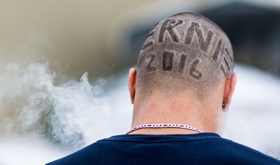 UNITED STATES - JANUARY 26 - Kenny Jackson, from Knoxville, Iowa, smoke a cigarette as he dons a shaved head in support of Democratic presidential candidate Sen. Bernie Sanders before a meeting at the United Steelworkers Local 310L in Des Moines, Iowa, Tuesday, Jan. 26, 2016.