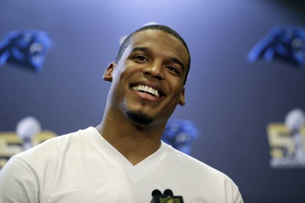 Carolina Panthers quarterback Cam Newton smiles as he answers questions during a press conference Tuesday, Feb. 2, 2016 in San Jose, Calif. Carolina plays the Denver Broncos in the NFL Super Bowl 50 football game Sunday, Feb. 7, 2015, in Santa Clara, Calif. (AP Photo/Marcio Jose Sanchez)