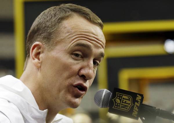 Denver Broncos' Peyton Manning answers a question during Opening Night for the NFL Super Bowl 50 football game Monday, Feb. 1, 2016, in San Jose, Calif. (AP Photo/Jeff Chiu)