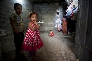 Children who fled the escalating violence in the southern part of Iraq share a small house with relatives in Turaq. The Office of the High Commissioner for Refugees (UNHCR) through its local implementing partner Public Aid Organization (PAO) provides food and non-food items, as well as legal protection and counselling for Internally Displaced Persons (IDPs), such as these children. Photo ID 480885. 04/07/2011. Erbil, Iraq.