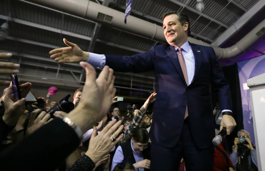 Republican presidential candidate, Sen. Ted Cruz, R-Texas, greets supporters  during a caucus night rally, Monday, Feb. 1, 2016, in Des Moines, Iowa. Cruz sealed a victory in the Republican Iowa caucuses, winning on the strength of his relentless campaigning and support from his party's diehard conservatives. (AP Photo/Charlie Neibergall)